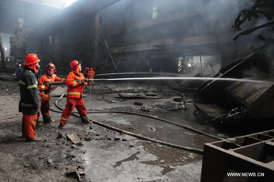 Firemen work at the site of a furnace explosion at the Xinyu Iron and Steel Group Company in Xinyu, east China's Jiangxi Province, April 1, 2013. A furnace exploded at 11:22 a.m. at the company on Monday, which killed four people and injured another 32. The injured have been hospitalized. (Xinhua/Song Zhenping)