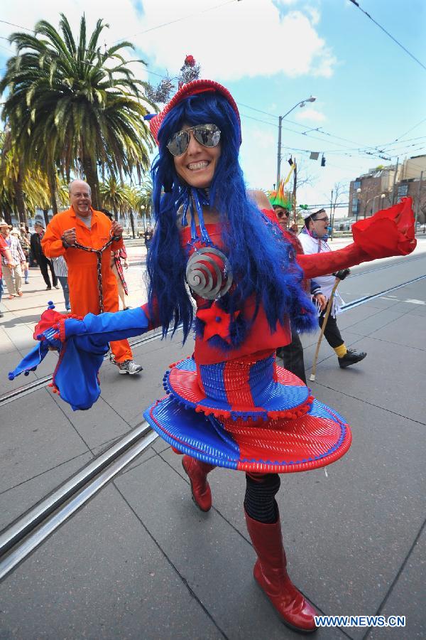 People take part in the annual St. Stupid's Day Parade held at the financial district in San Francisco, the United States, April 1, 2013. The 35th Annual St. Stupid's Day Parade was held on April Fool's Day in San Francisco. (Xinhua/Liu Yilin)