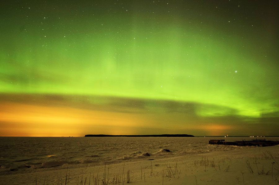 The brilliance of aurora shines in the night sky in Tallinn, capital of Estonia, on March 17. (Xinhua/AFP Raigo Pajula) 