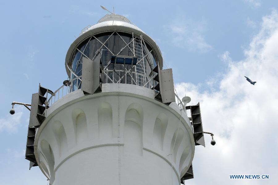 Photo taken on April 2, 2013 shows the Raffles Lighthouse on Singapore's southern island of Pulau Satumu. The Maritime Port Authority (MPA) of Singapore organized a visit for the media to the Raffles Lighthouse as a preview of the upcoming Singapore Maritime Week which will be held from April 7 to 12. (Xinhua/Then Chih Wey)