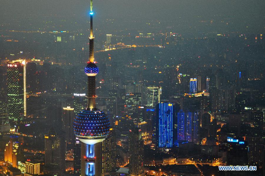 The Oriental Pearl TV Tower is illuminated in blue light to mark the World Autism Awareness Day in Shanghai, east China, April 2, 2013. (Xinhua/He Youbao)
