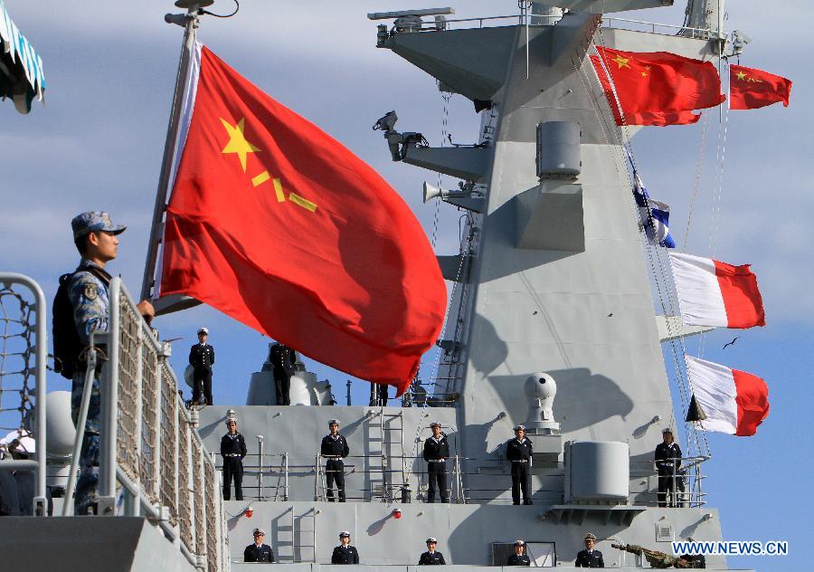 Chinese naval soldiers stand on the frigate at the habour of Algiers, Algeria, on April 2, 2013. The 13th naval escort squad, sent by the Chinese People's Liberation Army (PLA) Navy, arrived at Algiers of Algeria on Tuesday for a four-day visit after finishing its escort missions. (Xinhua/Mohamed Kadri) 