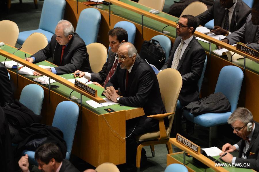 Bashar Ja'afari (R), permanent representative of Syria to the United Nations, speaks during a meeting on the Arms Trade Treaty at the UN headquarters in New York, April 2, 2013. The UN General Assembly on Tuesday voted to adopt the Arms Trade Treaty, which regulates the multi-billion-U.S. dollar international arms trade. The treaty was adopted by a vote of 154 to 3, with 23 countries abstaining from the vote. The Democratic People's Republic of Korea (DPRK), Iran and Syria voted against the treaty. (Xinhua/Niu Xiaolei) 