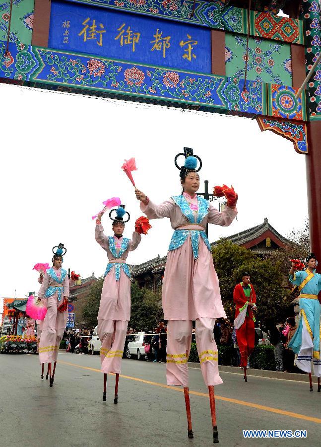 Performers walk on stilts during a spring parade for the upcoming Tomb-sweeping Day in Kaifeng, central China's Henan Province, April 3, 2013. Thousands of performers and citizens participated in the parade. (Xinhua/Wang Song)