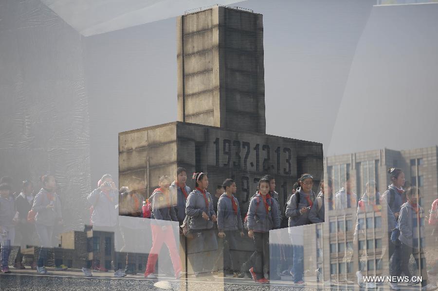 Students visit the Memorial Hall of the Victims in Nanjing Massacre by Japanese Invaders, in Nanjing, capital of east China's Jiansu Province, April 3, 2013. Lots of citizens came here to mourn Nanjing Massacre victims on the occassion of Qingming Festival, or Tomb-Sweeping Day, which falls on April 4 this year. (Xinhua/Han Hua)