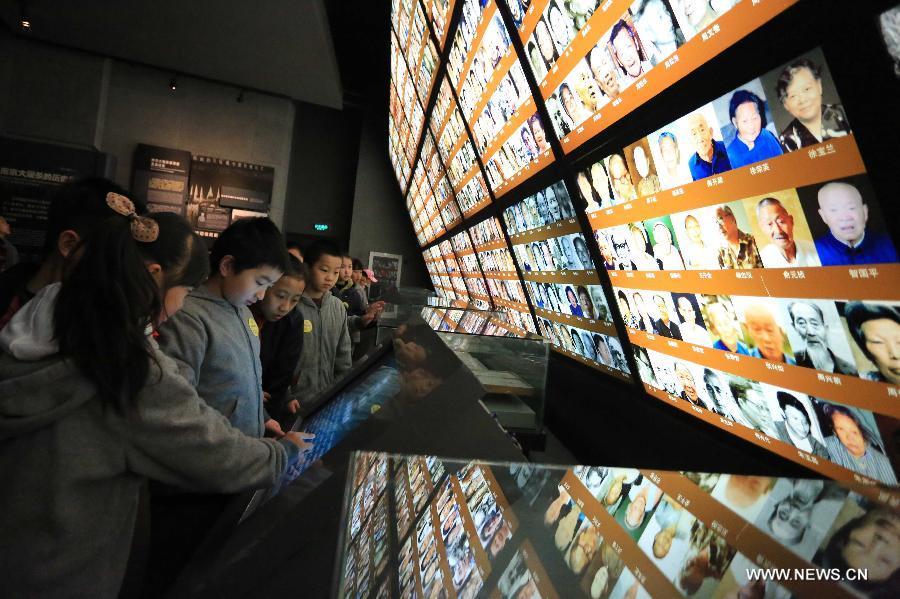 Students visit the Memorial Hall of the Victims in Nanjing Massacre by Japanese Invaders, in Nanjing, capital of east China's Jiansu Province, April 3, 2013. Lots of citizens came here to mourn Nanjing Massacre victims on the occassion of Qingming Festival, or Tomb-Sweeping Day, which falls on April 4 this year. (Xinhua/Han Hua)