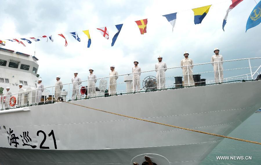 A ceremony is held by the Hainan Maritime Safety Administration on the patrol vessel "Haixun 21" in Haikou, capital of south China's Hainan Province, April 3, 2013. A fleet of five marine surveillance ships will monitor maritime traffic safety, investigate maritime accidents, detect pollution, and carry out other missions around the clock during the Boao Forum for Asia Annual Conference 2013 in Hainan. (Xinhua/Zhao Yingquan)