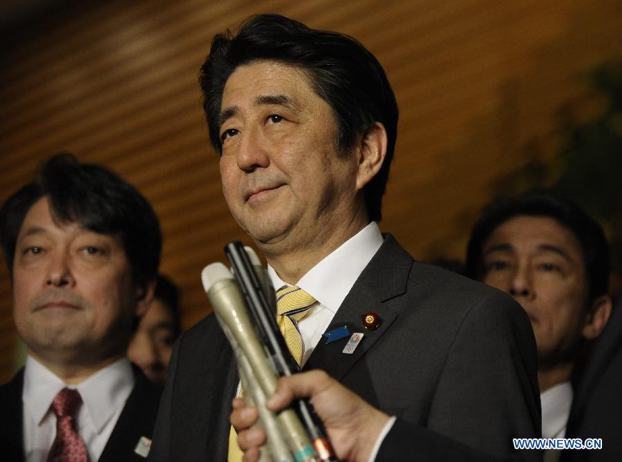 Japanese Prime Minister Shinzo Abe speaks to reporters at his official residence in Tokyo April 5, 2013. Shinzo Abe on Friday unveiled a Japan-U.S. time frame on returning Okinawa's land used by the U.S. military to the Japanese southernmost prefecture. (Xinhua/Kenichiro Seki)