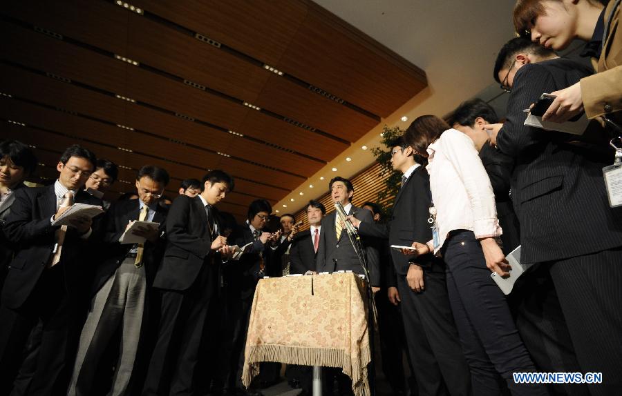 Japanese Prime Minister Shinzo Abe speaks to reporters at his official residence in Tokyo April 5, 2013. Shinzo Abe on Friday unveiled a Japan-U.S. time frame on returning Okinawa's land used by the U.S. military to the Japanese southernmost prefecture. (Xinhua/Kenichiro Seki)