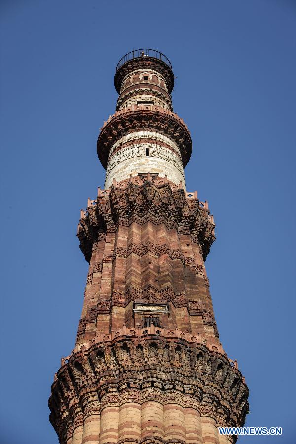 Photo taken on April 5, 2013 shows the top part of Qutab Minar in New Delhi, India. Qutab Minar, a UNESCO World Heritage Site, is the tallest minaret in India. It is 75.56 metres high with a base a diameter of 14.3 metres, which narrows to 2.7 metres at the top storey. The minar is made of red sandstone and marble, and covered with intricate carvings. The construction of Qutab Minar started in 1193 by Qutub-ud-din Aibak and was completed by his inheritor Iltutmish. It is surrounded by several other ancient and medieval structures and ruins, collectively known as the Qutub complex, which attracts many visitors till now. (Xinhua/Zheng Huansong)