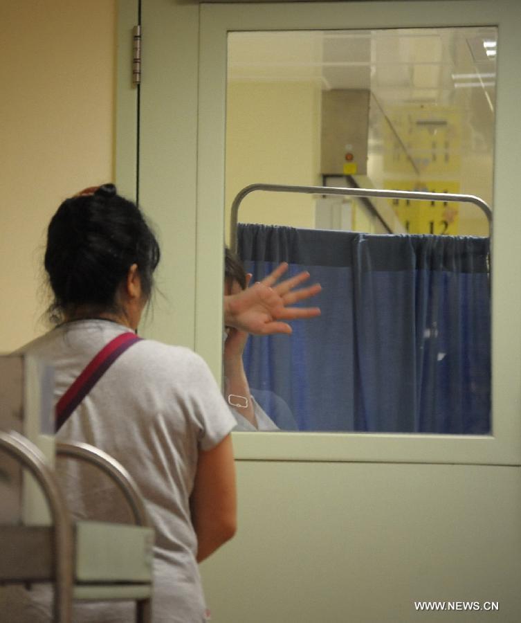 Photo taken on April 5, 2013 shows the entrance to the A9 isolation wards at the Queen Elizabeth Hospital in Hong Kong, south China. An offcial of Hong Kong's Hospital Authority said on Friday that a seven-year-old girl in Hong Kong was reported the symptom of fever and received treatment at the Queen Elizabeth Hospital, who had been in close contact with birds in Shanghai last month. And the result whether she is infected with H7N9 virus is expected to come out Friday night. (Xinhua/Lui Siu Wai)