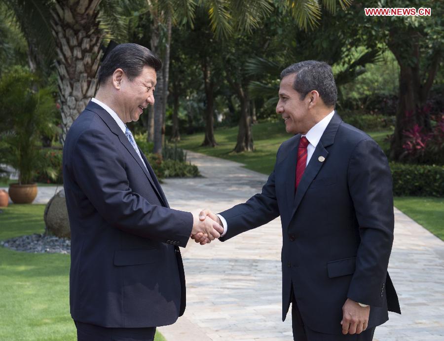 Chinese President Xi Jinping (L) shakes hands with visiting Peruvian President Ollanta Humala ahead of their talks in Sanya, south China's Hainan Province, April 6, 2013. Visiting China as Xi's guest, Humala will also attend the opening ceremony of the annual Boao Forum for Asia on Sunday in Hainan. (Xinhua/Wang Ye)