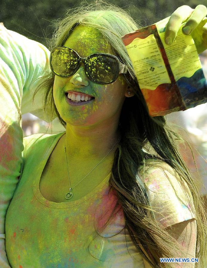 A reveler celebrates Holi, the Indian Festival of Colors, April 6, 2013. Holi is all about celebrating the colors and vitality of spring, with family and friends. (Xinhua/Li Qihua) 