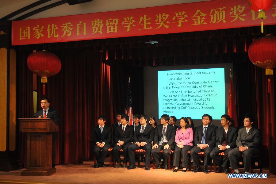 Bi Gang (L), vice consul general of China in San Francisco, speaks at the awarding ceremony of Chinese Government Award for Outstanding Self-financed Students Overseas at the consulate general of the People's Republic of China in San Francisco, April 5, 2013. All together 20 students from the University of California at Berkeley, Stanford University, Washington University, University of California at Davis and Washington State University won the scholarship. (Xinhua/Liu Yilin)