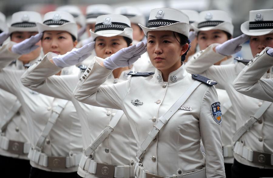 Traffic policewomen receives training in Neijiang City, southwest China's Sichuan Province, April 2, 2013. Founded in April, 2011, the female detachment of local traffic police force includes 2 police officers and 28 auxiliary police officers, with an average age of 23. (Xinhua/Xue Yubin)