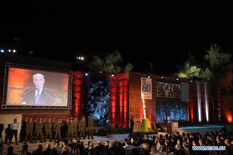Israeli President Shimon Perez speaks during the official ceremony for Israeli annual Holocaust Martyrs and Heroes Remembrance Day at the Yad Vashem Holocaust memorial in Jerusalem on April 7, 2013. (Xinhua/Jini) 