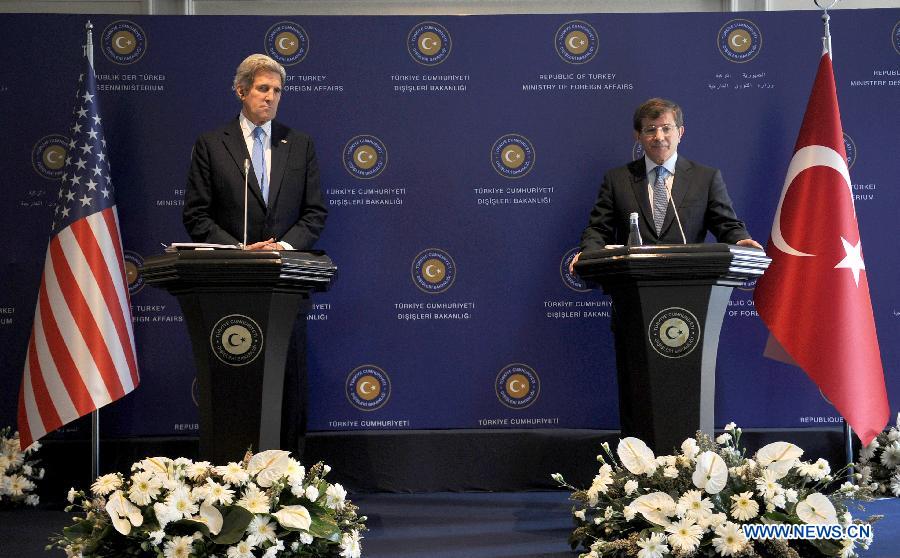 U.S. Secretary of State John Kerry (L) attends a joint press conference with Turkish Foreign Minister Ahmet Davutoglu after arriving at Istanbul, Turkey, April 7, 2013, as a part of his third trip to the Middle East in one month. Kerry will meet with Turkish Prime Minister Erdogan Sunday afternoon. (Xinhua/Lu Zhe) 