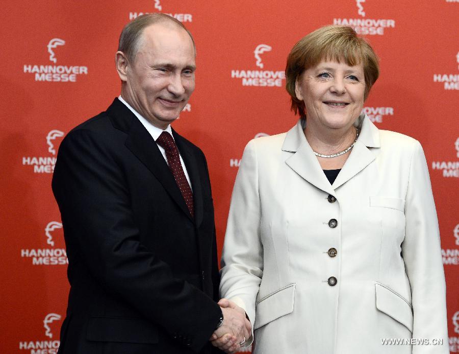 German Chancellor Angela Merkel (R) and Russian President Putin attend opening ceremony of the Hanover industrial trade fair in Hanover, western Germany. on April 7, 2013. Russia is the partner country of the Hanover industrial trade fair 2013, which runs from April 8 to 12. (Xinhua/Ma Ning)