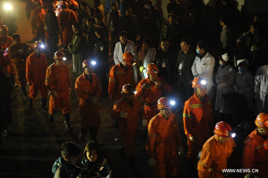 Rescuers line up to get into the mine shaft of a flooded coal mine in Weng'an County, southwest China's Guizhou Province, April 8, 2013. Three miners trapped in the flooded Yunda Coal Mine for about 60 hours were rescued early Monday morning. Three others remained missing at the mine, which was hit by flood last Friday. Rescuers had earlier confirmed that three miners had been dead. (Xinhua/Liu Xu)