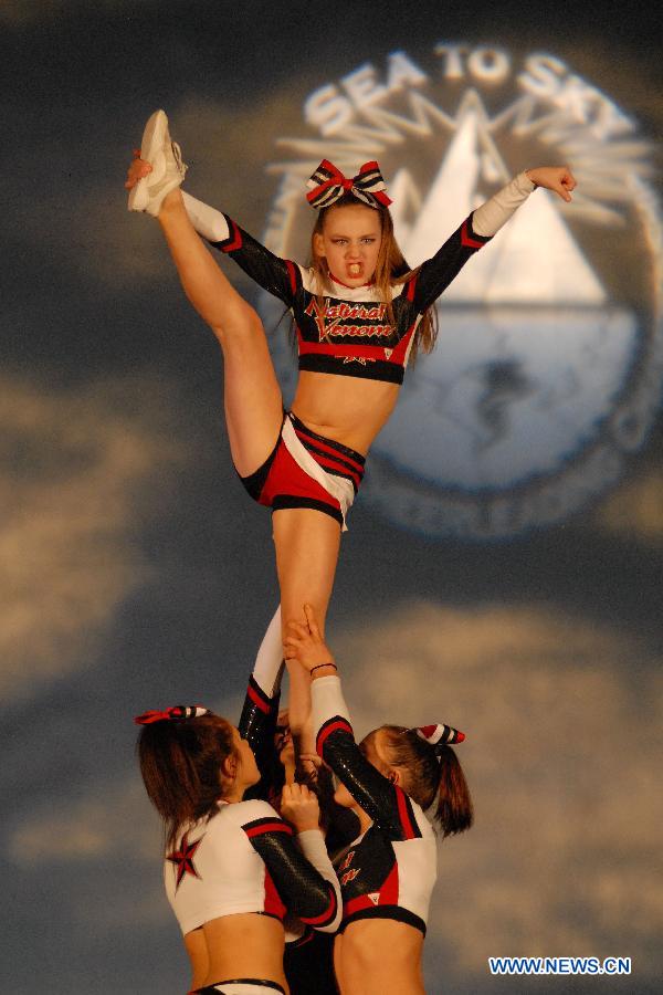 Cheerleaders compete during the 2013 Sea to Sky International Cheerleading Championship in Vancouver, Canada, on April 7, 2013. More than 3,500 athletes from 135 cheerleading teams competed for a chance to perform at the 2013 World Cheerleading Championship in Orlando, Florida, at the end of April 2013. (Xinhua/Sergei Bachlakov) 