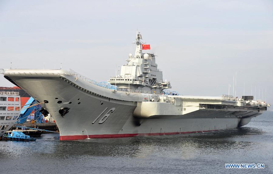 Undated photo shows an aircraft carrier berthing in a port of China. (Xinhua File Photo/Li Tang)