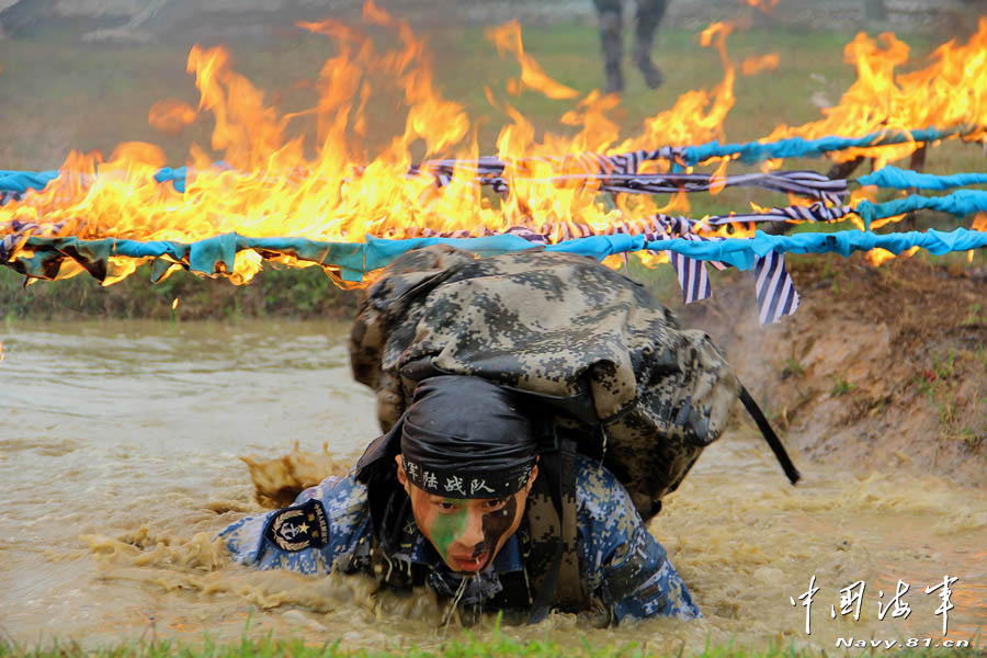 The marine of a brigade of the Navy of the Chinese People's Liberation Army (PLA) is in military skill training in a simulated actual-battlefield environment. (navy.81.cn/Zeng Liang)
