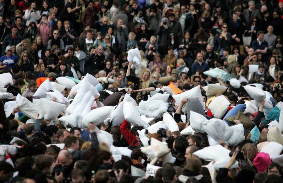 People participate in the World Pillow Fight Day at the Trafalgar Square, London, April 6. (Xinhua/Bimal Gautam).
