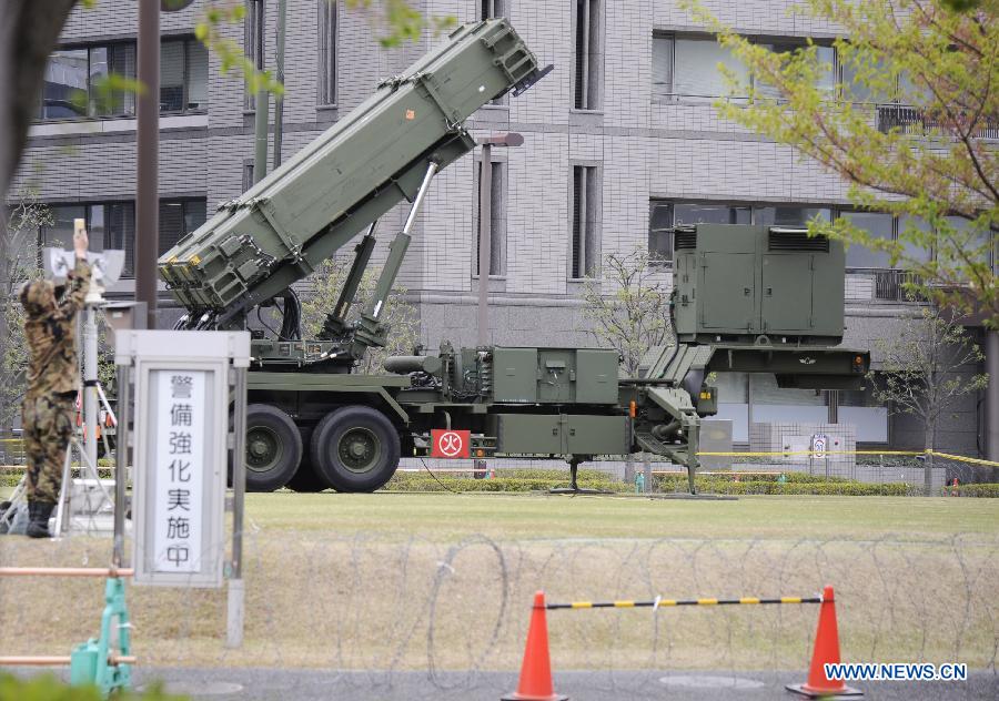 A Japan Self-Defense Forces soldier stands guard near PAC-3 missiles at the Defense Ministry in Tokyo, capital of Japan, April 9, 2013. Japan's Defense Ministry deployed Tuesday Patriot Advanced Capability-3 (PAC-3) missile interceptor in central Tokyo, in a move to prepare for the possible missile launch of the Democratic People's Republic of Korea. (Xinhua/Kenichiro Seki)