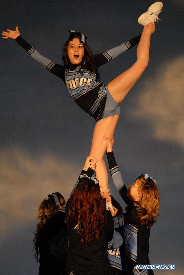 Cheerleaders compete during the 2013 Sea to Sky International Cheerleading Championship in Vancouver, Canada, on April 7, 2013. More than 3,500 athletes from 135 cheerleading teams competed for a chance to perform at the 2013 World Cheerleading Championship in Orlando, Florida, at the end of April 2013. (Xinhua/Sergei Bachlakov)