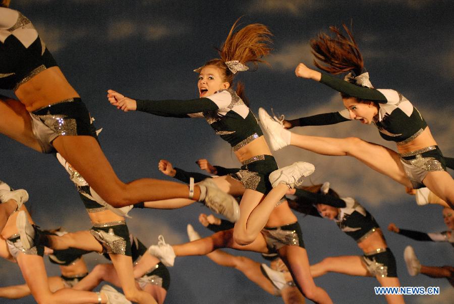 Cheerleaders compete during the 2013 Sea to Sky International Cheerleading Championship in Vancouver, Canada, on April 7, 2013. More than 3,500 athletes from 135 cheerleading teams competed for a chance to perform at the 2013 World Cheerleading Championship in Orlando, Florida, at the end of April 2013. (Xinhua/Sergei Bachlakov)