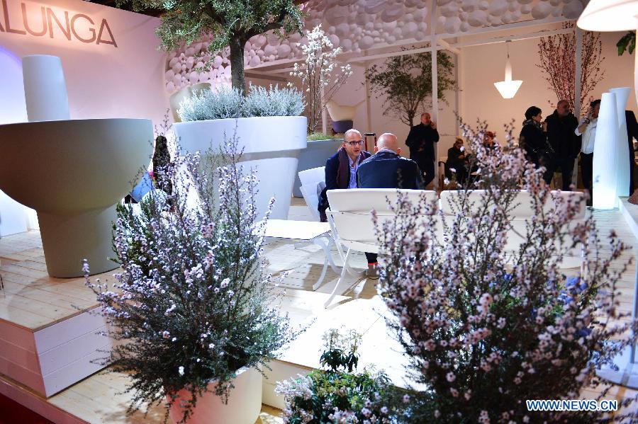 People visit at the Milan International Furniture Fair in Milan, Italy, on April 9, 2013. The 52nd edition of Milan's annual furniture fair is taking place from April 9 to 14. (Xinhua/Xu Nizhi) 