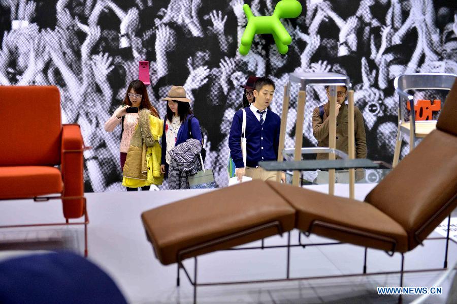 People visit at the Milan International Furniture Fair in Milan, Italy, on April 9, 2013. The 52nd edition of Milan's annual furniture fair is taking place from April 9 to 14. (Xinhua/Xu Nizhi) 