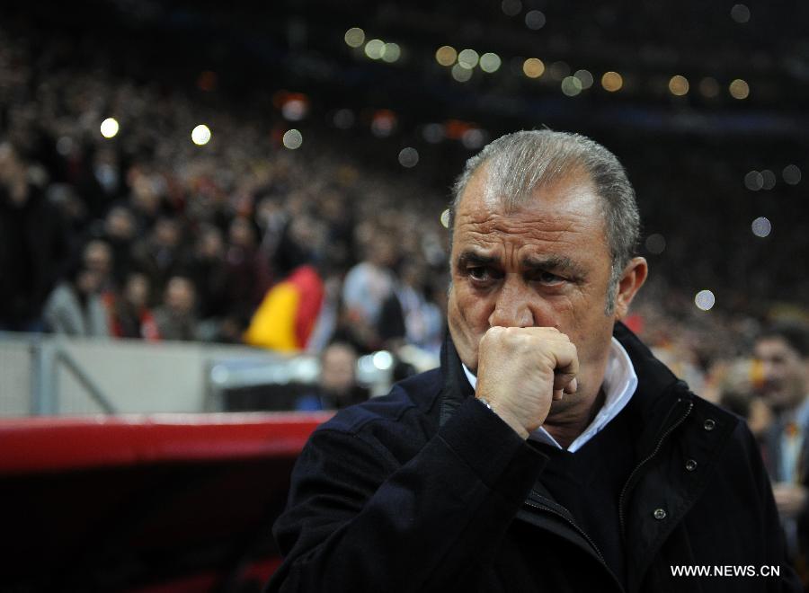 Galatasaray's coach Fatih Terim reacts during the UEFA Champions League quarter final second leg soccer match between Galatasaray and Real Madrid in Istanbul, Turkey, April 9, 2013. Real Madrid lost 2-3 but entered the semifinal with a total result 5-3.(Xinhua/Ma Yan)