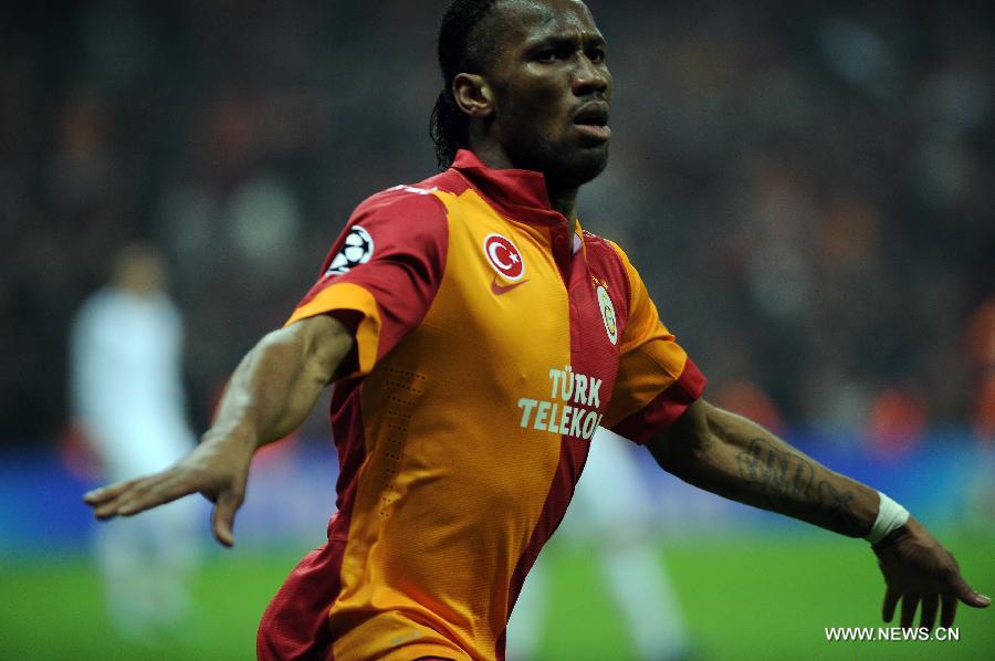 Galatasaray's Didier Drogba celebrates after scoring a goal during the UEFA Champions League quarter final second leg soccer match between Galatasaray and Real Madrid in Istanbul, Turkey, April 9, 2013. Real Madrid lost 2-3 but entered the semifinal with a total result 5-3.(Xinhua/Ma Yan)