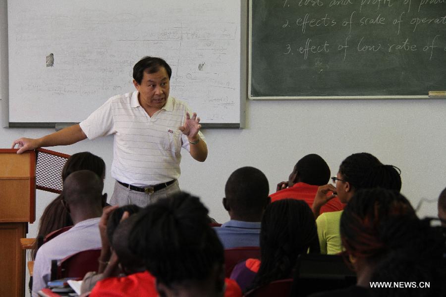 Wang Jiuliang, a chemistry teacher from China, teaches at University of Namibia in Windhoek, Namibia, April 9, 2013. To fulfill the agreement on higher-education cooperation between China and Namibia, China's universities started dispatching teachers to work at University of Namibia since mid-1990s. The Chinese teachers have since gained respect and good reputation because of their diligent work and serious attitude in academics. They have made remarkable contributions to the cultivation of local talents and the friendship between China and Namibia. (Xinhua/Gao Lei) 
