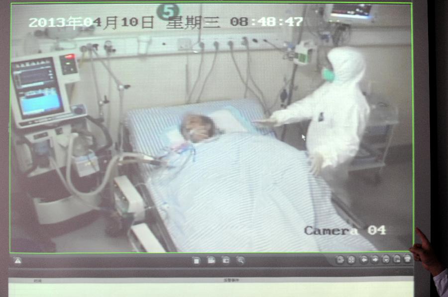 A monitor screen shows a nurse taking care of an H7N9-contracted patient in Hangzhou, capital of east China's Zhejiang Province, April 10, 2013. As of Tuesday afternoon, China had reported a total of 28 H7N9 cases in Shanghai municipality and the provinces of Jiangsu, Anhui and Zhejiang, including nine fatalities, according to the National Health and Family Planning Commission. (Xinhua/Ju Huanzong)