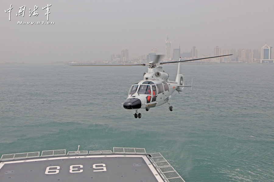 The "Anqing" warship of a maritime garrison of the East China Sea Fleet under the Navy of the Chinese People's Liberation Army (PLA) carried out coordinated-drill with a helicopter of a troop unit of the North China Sea Fleet under the PLA Navy on April 8, 2013, so as to enhance the combat-mission-performing capability of the troops. (China Military Online/Luo Shangguan)