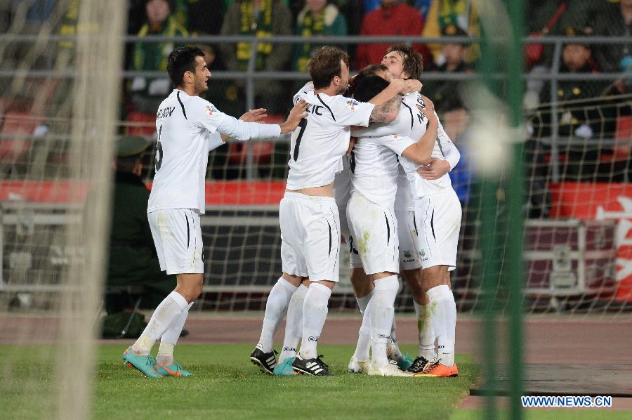 Players of Bunyodkor celebrate for score during their AFC Champions League Group G match against Beijing Guoan in Beijing, China, April 10, 2013. (Xinhua/Guo Yong)