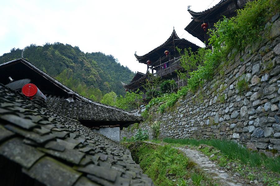 Photo taken on April 10, 2013 shows stilted buildings in Lianghekou Village in Enshi, central China's Hubei Province. Stilted buildings of Tujia ethnic group, mainly seen in central China's Hunan and Hubei Province, is a gem of Chinese residence. Lianghekou Village is one of the best reserved areas for Tujia stilted buildings. (Xinhua/Song Wen) 