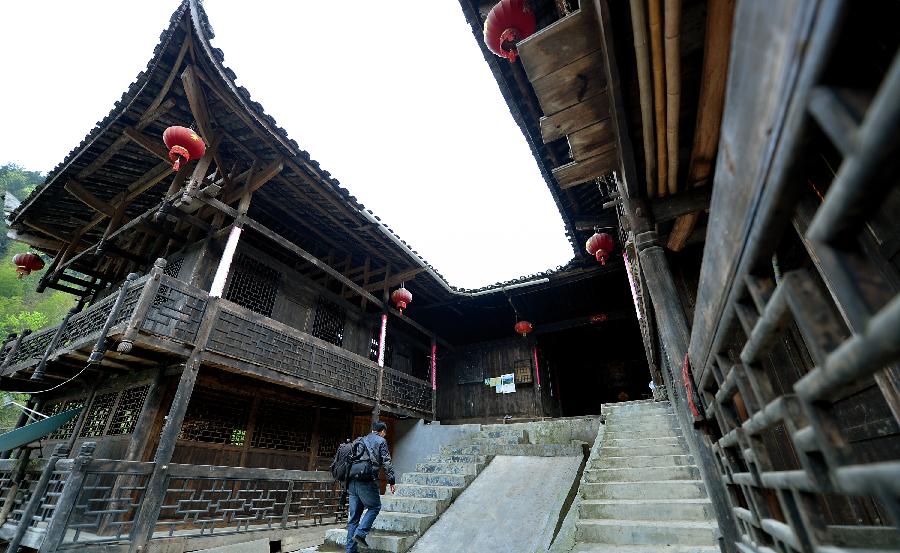 Photo taken on April 10, 2013 shows stilted buildings in Lianghekou Village in Enshi, central China's Hubei Province. Stilted buildings of Tujia ethnic group, mainly seen in central China's Hunan and Hubei Province, is a gem of Chinese residence. Lianghekou Village is one of the best reserved areas for Tujia stilted buildings. (Xinhua/Song Wen) 