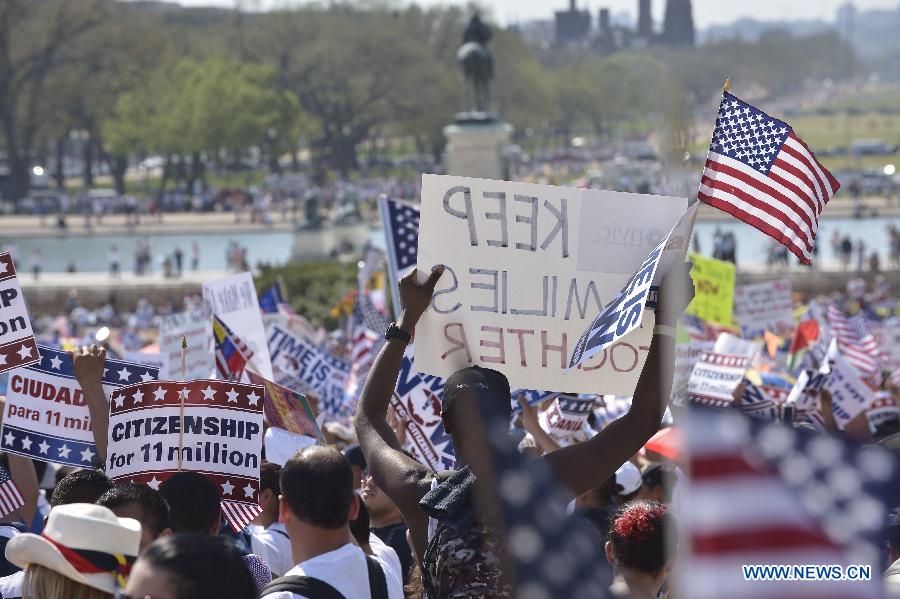 Immigration reform supporters demonstrate in the "Rally for Citizenship" on the West Lawn of Capitol Hill in Washington D.C., capital of the United States, April 10, 2013. Two senior U.S. Senators, Democratic Senator Charles Schumer and Republican Senator John McCain, who are working together to broker an immigration reform plan on Sunday, expressed optimism that a bill could be ready within this week. (Xinhua/Zhang Jun) 