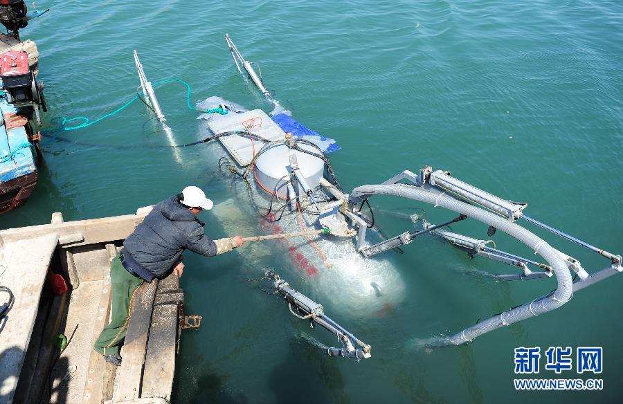 A homemade "robot submarine" is put into the sea for tests in Yantai city, Shandong province on April 10. The submarine was made by Zhang Wuyi, 38, a laid-off worker in Wuhan city, Hubei province. Since he was laid off from a textile machinery factory in 2008, Zhang has been interested in small submarines. He has invested around 3 million yuan ($484,000) into the creation. After failing several times, finally he made several private submarines. The machine, 4.5 meters long, 1.6 meter wide and 4 tons heavy, can sink into 30-50 meters underwater and advance slowly by remote control. One has been ordered by an aquaculture company in Yantai.(Photo/Xinhua)
