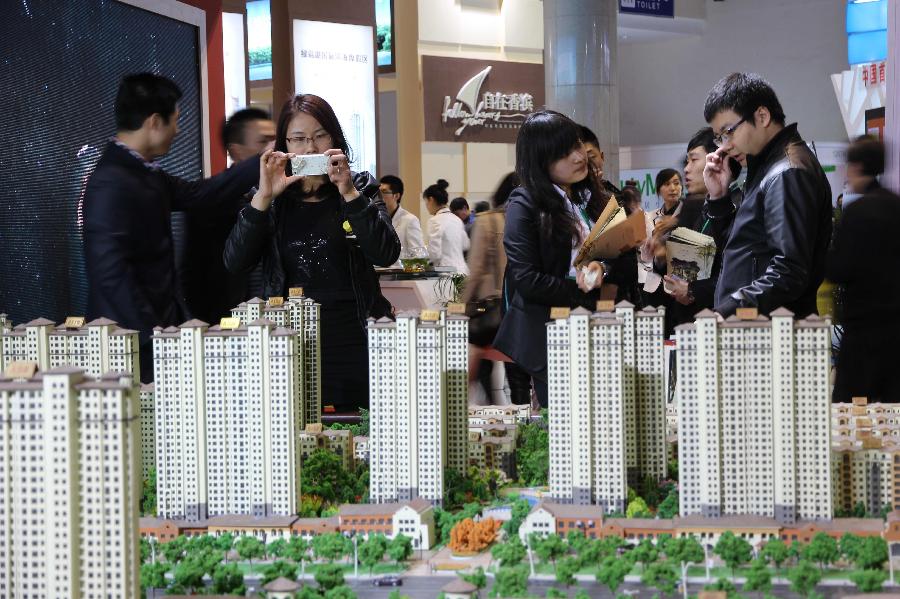 People visit 2013 Spring Beijing International Property Expo in Beijing, capital of China, April 11, 2013. The four-day expo kicked off on Thursday at Beijing Exhibition Centre. (Xinhua/Wang Yueling)