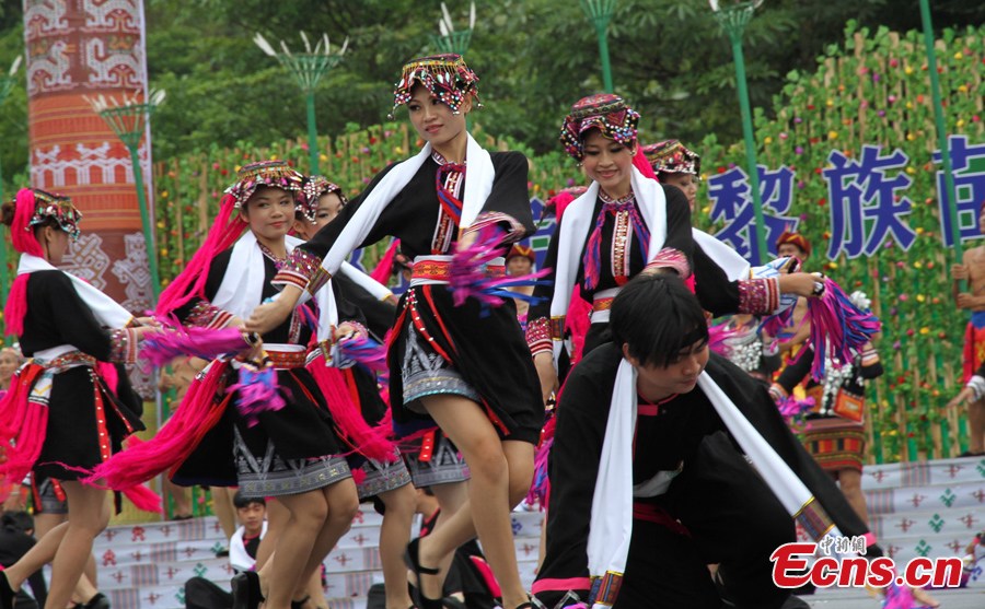 Women of the Li ethnic group perform at the Sanyuesan Festival in Qiongzhong, Hainan Province, April 11, 2013. The festival, which is celebrated on the third day of the third lunar month, provides unmarried young people an opportunity to find their loved ones. On that day the young boys and girls from nearby settlements get together in bright and attractive clothing. They hold hands and sing songs, do bamboo pole dancing, and have their dates in houses that are shaped like boats. (CNS/Fu Meibin)