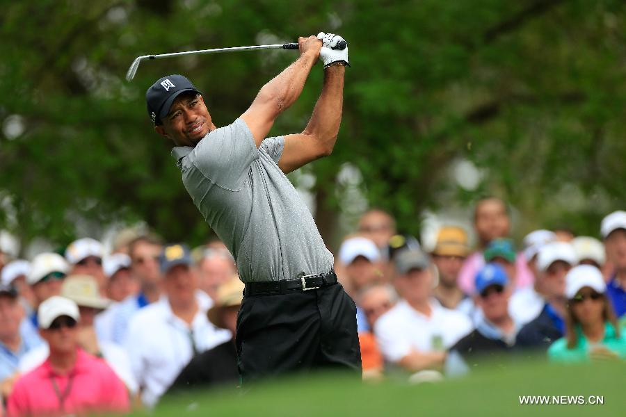 Tiger Woods of the United States competes during the first round of the 2013 Masters golf tournament at the Augusta National Golf Club in Augusta, Georgia, the United States, April 11, 2013. Woods shot a two-under par 70 on Thursday. (Xinhua/Sam Greenwood/Augusta National)