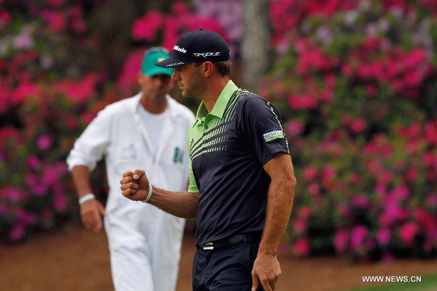 Dustin Johnson of the United States jubilates during the first round of the 2013 Masters golf tournament at the Augusta National Golf Club in Augusta, Georgia, the United States, April 11, 2013. Johnson shot a 5-under par 67 on Thursday. (Xinhua/Hunter Martin/Augusta National)
