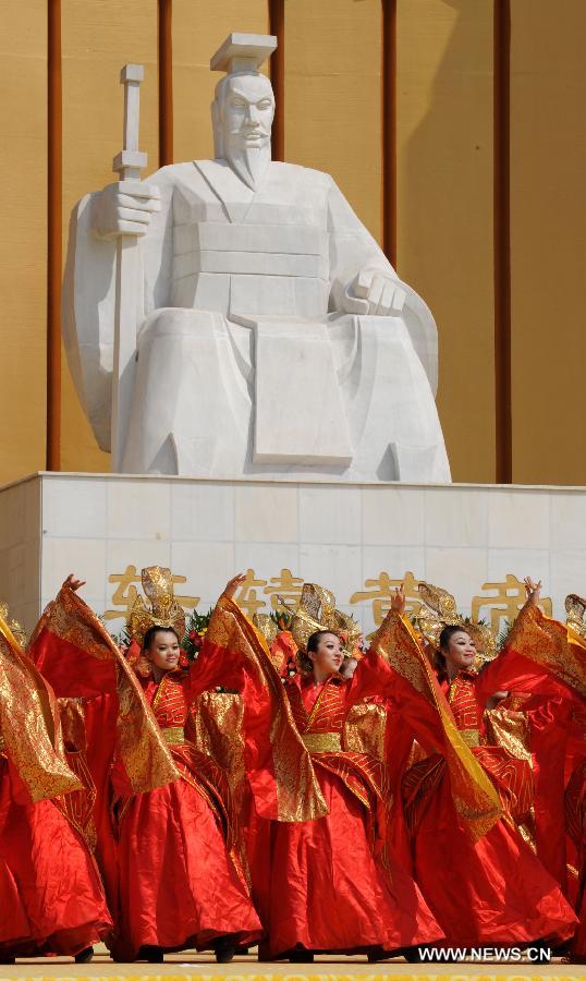 Performers dance in a ceremony paying homage to Huang Di, or Yellow Emperor, who is considered as the ancestor of all Chinese people, in Xinzheng City, central China's Henan Province, April 12, 2013. (Xinhua/Li Bo)