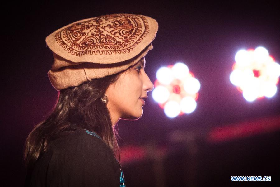 A student from Afghanistan participates in a fashion show in Jawaharlal Nehru University (JNU) in New Delhi, capital of India, April 12, 2013. International students from 14 countries and regions in the JNU held a fashion show on Friday night in New Delhi. (Xinhua/Zheng Huansong)