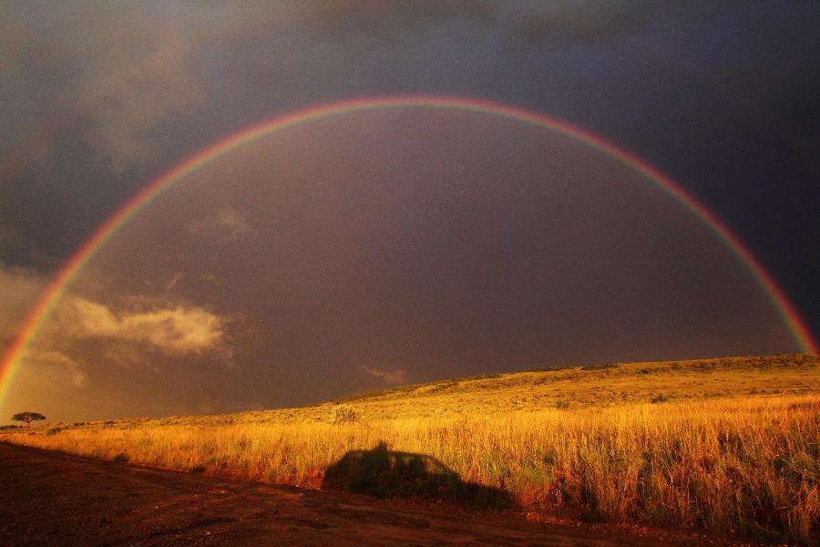 Photo taken on April 10, 2013 shows a rainbow over the Maasai Mara National Reserve, southwest Kenya. (Xinhua/Li Jing)