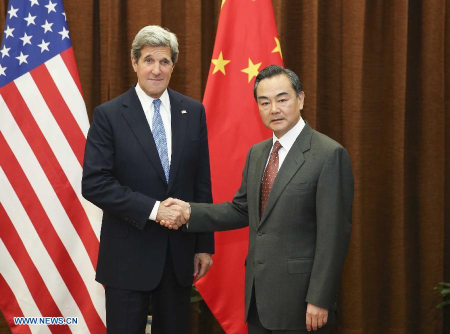 Chinese Foreign Minister Wang Yi (R) shakes hands with U.S. Secretary of State John Kerry in Beijing, capital of China, April 13, 2013. (Xinhua/Ding Lin)